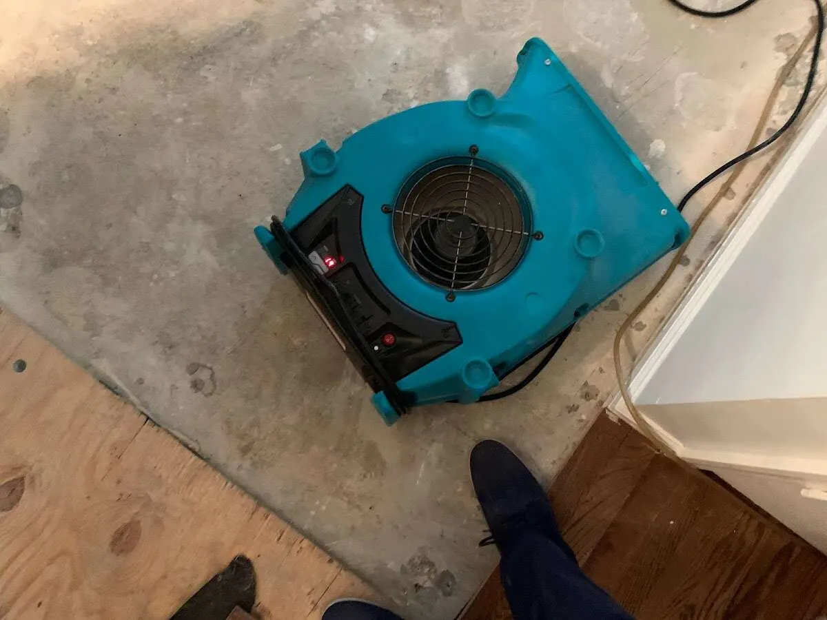 Air mover drying subfloor during Leak Detection & Repair in Hurst